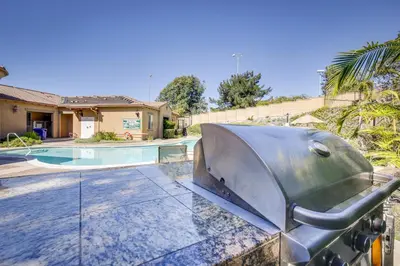 a metal sculpture in front of a swimming pool at Modern Pet-Friendly San Diego Vacation Rental in San Diego