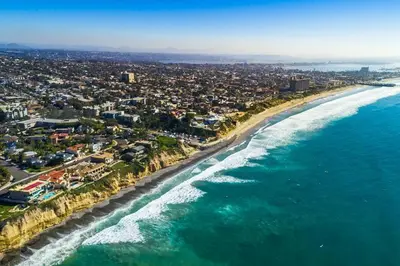 an aerial view of a beach and the ocean at Celebrity Oceanfront Estate in San Diego