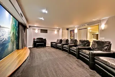 a living room with a couch and a piano at Celebrity Oceanfront Estate in San Diego