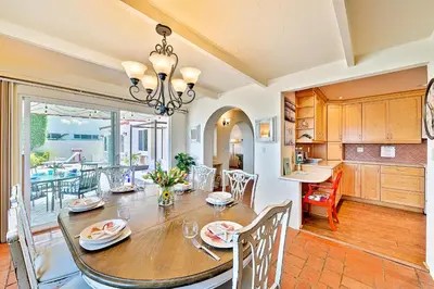 a kitchen and dining room with a table and chairs at On The Beach Casa in San Diego