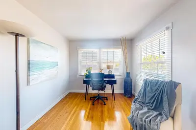 a home office with a blue chair and a desk at Carthage Corner in San Diego
