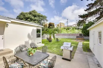 a patio with a table and chairs and a grill at Pet-Friendly San Diego Home with Patio 5 Mi to Dtwn in San Diego