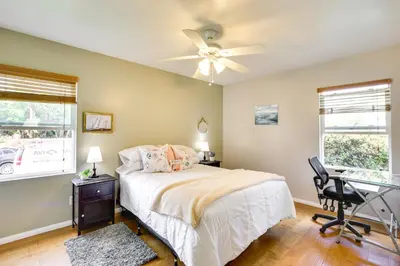 a bedroom with a bed and a desk and a ceiling fan at Pet-Friendly San Diego Home with Patio 5 Mi to Dtwn in San Diego
