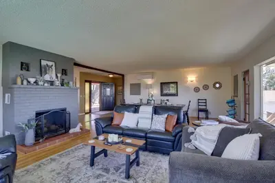 a living room with a couch and a fireplace at Charming Spring Valley Retreat with Private Pool! in Spring Valley