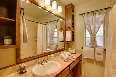a bathroom with a sink and a mirror at Charming Spring Valley Retreat with Private Pool! in Spring Valley