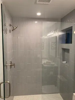 a shower with a glass door and a sink at Smashing Newly-Built with Ocean/Bay/City Views! in San Diego