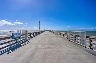 a boardwalk leading to the ocean on a beach at Newport Beach Vacation Rental - Short Walk to Pier in Newport Beach