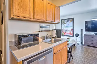 a kitchen with a sink and a microwave at Newport Beach Vacation Rental - Short Walk to Pier in Newport Beach