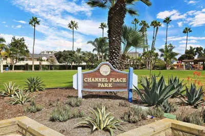 a sign for a garden place park with palm trees at 210 Forty Fourth Street in Newport Beach