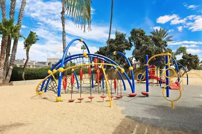 a playground in a park with a bunch of play equipment at 210 Forty Fourth Street in Newport Beach