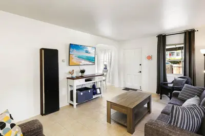 a living room with a couch and a table at 210 Forty Fourth Street in Newport Beach