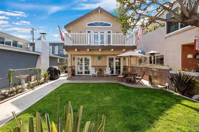 a house with a yard with green grass at 821 West Bay Avenue in Newport Beach