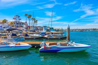 a group of boats are docked in a marina at 821 West Bay Avenue in Newport Beach