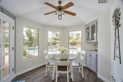 a dining room with a ceiling fan and a table at Casa Rosé in Temecula