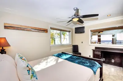 a bedroom with a bed and a ceiling fan at Villa Bella Mare at the Retreat in Laguna Beach in Laguna Beach