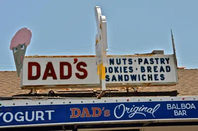two signs on the top of a building at 201 Ruby in Newport Beach
