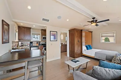 a living room and kitchen with a couch and a table at Villa D'Arte at the Retreat in Laguna Beach in Laguna Beach