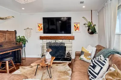 a living room with a couch and a fireplace at Your Private Resort near Coast in Oceanside