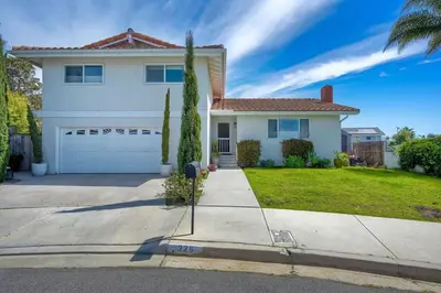 a white house with a parking meter in front of it at Your Private Resort near Coast in Oceanside