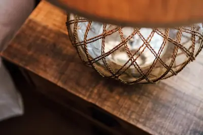 a wire basket sitting on top of a wooden table at 1400 S Bayfront in Newport Beach