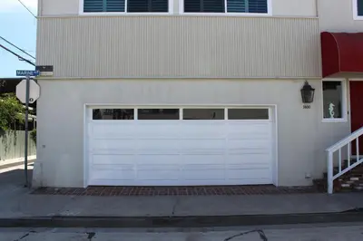 a white garage door on the side of a house at 1400 S Bayfront in Newport Beach