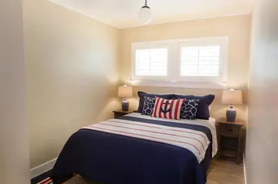 a bedroom with a bed and a window at 1400 S Bayfront in Newport Beach