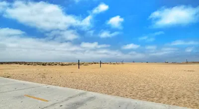 a beach with two volleyball nets in the sand at 1005 E Balboa 2 in Newport Beach
