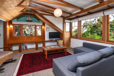 a living room with a couch and a tv at 318 Lindo Ave in Newport Beach