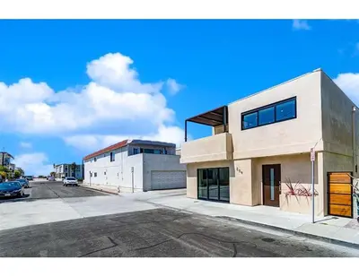 a building on the side of a street at 209 9th St in Newport Beach