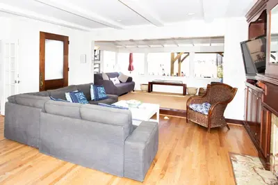 a living room with a couch and a table at 1002 E Oceanfront in Newport Beach