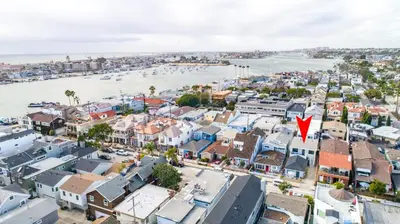 an aerial view of a city with a red arrow at 129 Opal Ave A & B in Newport Beach
