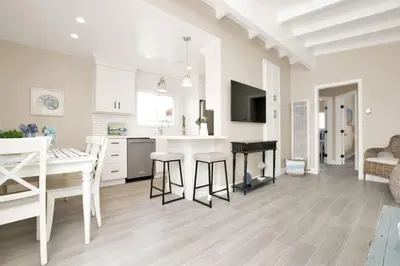 a kitchen and dining room with a table and a desk at 114 Forty Second Street B in Newport Beach