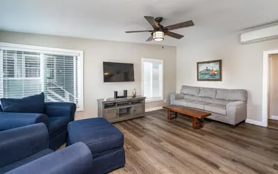 a living room with two couches and a flat screen tv at 129 Opal Ave B in Newport Beach
