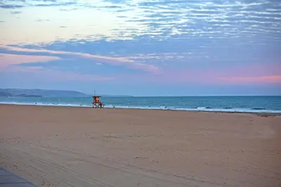 a beach with a lifeguard stand on the beach at 114 Forty-Second Street A in Newport Beach
