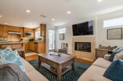 a living room with a couch and a table at 310 and a half Iris Ave in Newport Beach