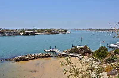 a view of a body of water with a dock at 310 and a half Iris Ave in Newport Beach