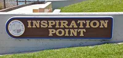 a sign for an immigration point on a sign at 310 and a half Iris Ave in Newport Beach
