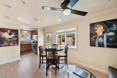 a dining room with a table and a ceiling fan at Villa Rustico at the Retreat in Laguna Beach in Laguna Beach