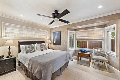a bedroom with a bed and a ceiling fan at Villa Rustico at the Retreat in Laguna Beach in Laguna Beach