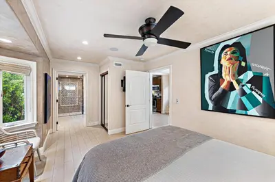 a bedroom with a bed and a ceiling fan at Villa Rustico at the Retreat in Laguna Beach in Laguna Beach