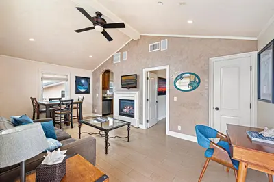 a living room with a couch and a ceiling fan at Villa Teatro at the Retreat in Laguna Beach in Laguna Beach