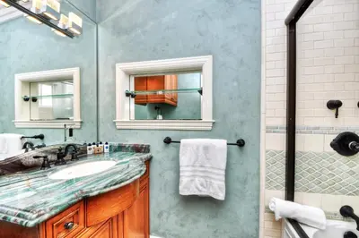 a bathroom with a sink and a shower at Villa Roma at the Retreat in Laguna Beach in Laguna Beach