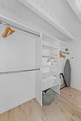 a room with a closet with white shelves at Sleepy Hollow Villas #2 in Laguna Beach in Laguna Beach
