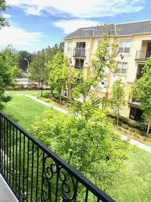 a view of a building from a balcony at Luxury condo near Irvine Business & UCI Hospital in Irvine