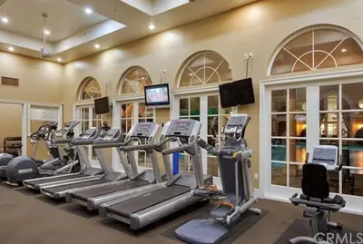 a gym with treadmills and elliptical machines at Luxury condo near Irvine Business & UCI Hospital in Irvine