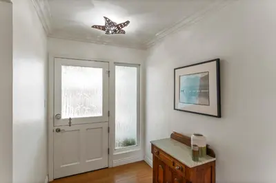 a white room with a door and a window at Luxury Beach House. Pool/Hot Tub! Walk to Beach! in Carlsbad
