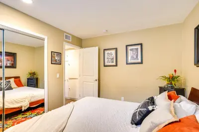 a bedroom with two beds and a mirror at Newport Beach Vacation Rental Steps to Shore! in Newport Beach