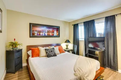 a bedroom with a bed and a flat screen tv at Newport Beach Vacation Rental Steps to Shore! in Newport Beach