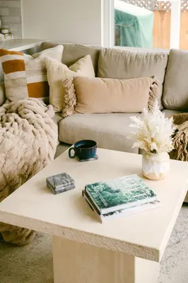 a coffee table in a living room with a couch at Luxe OB Home, Walk to Beach, Sauna, and Backyard in San Diego