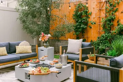 a patio with a table with food on it at Luxe OB Home, Walk to Beach, Sauna, and Backyard in San Diego